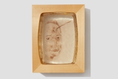 You Need Another Lover Like You Need a Hole in Your Head, 2004, hand-sewn human hair on mylar encased in 3-layer resin cast, 9” x 7” x 2”