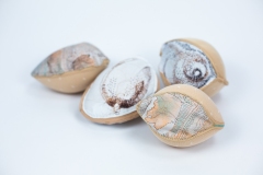 Seeds, 2026, hand-stitched and machine-sewn, specialty fabric, thread, adhesive bra cups, 6" x 4" x 2" each — Photography by Mariah Richstone