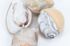 Seeds, 2026, hand-stitched and machine-sewn, specialty fabric, thread, adhesive bra cups, 6" x 4" x 2" each — Photography by Mariah Richstone